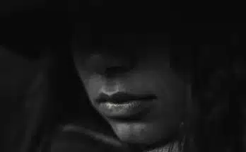 grayscale photo of person's lips